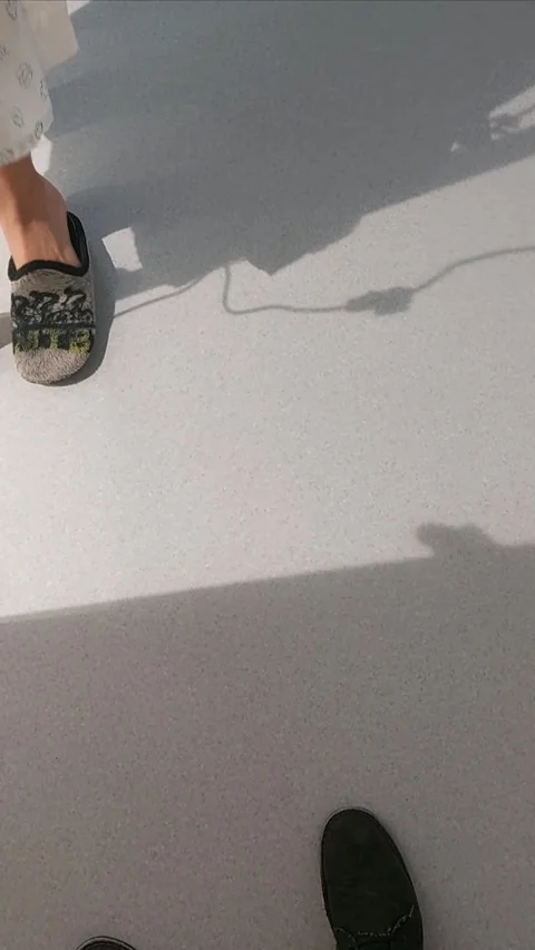 Low Angle View of Hospital Patient Walking and Rolling IV Stand Along Floor Vídeo Stock 341475388