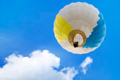 Low angle view of a hot air balloon in a blue sky Stock Photos