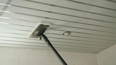 Low-angle view of household cleaning routine using steam mop to remove dirt and Video stock 318750186