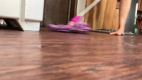 Low-Angle View Of A Housewife Mopping wooden Floor. Stock Footage 343519122