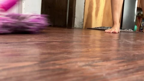 Low-Angle View Of A Housewife Mopping wooden Floor Vídeo Stock 343519329