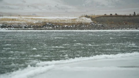 Low angle view of ice flowing down Montana river Stock Footage 327686814