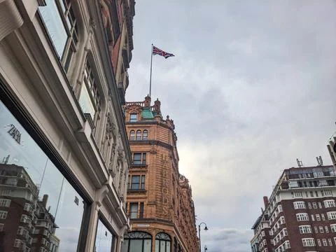 Low angle view of the iconic Harrods luxury department stores facade under a Stock Photos