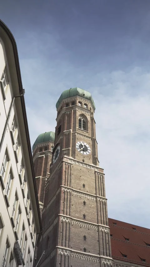 Low angle view of the iconic twin towers of the frauenkirche cathedral against a 스톡 동영상 333694465