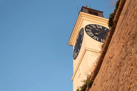 Low-angle view of the iconic white clock tower at Petrovaradin Fortress Stock Photos