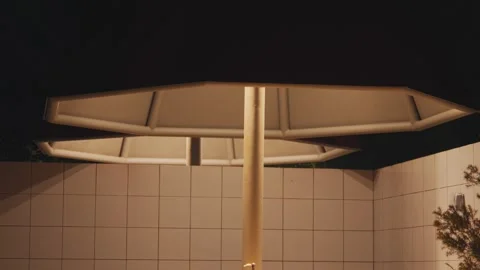 Low Angle View of Illuminated Large Outdoor Patio Umbrella Vidéo 282003526