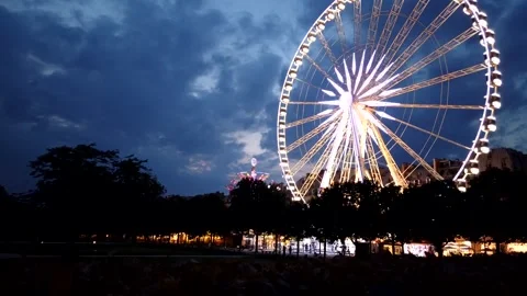 Low Angle View of Illuminated Roue de Paris Ferris Wheel at Twilight in Paris Stock Footage 327422919