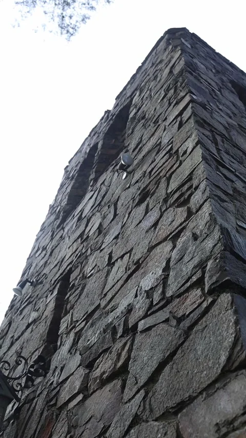 Low angle view of an imposing stone tower corner Stock Footage 341913121