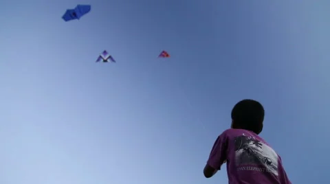 Low angle view of Indian boy kiting at beach in Goa. Stock Footage 49667582