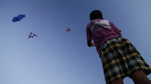Low angle view of Indian boy kiting at beach in Goa. Video stock 49667671