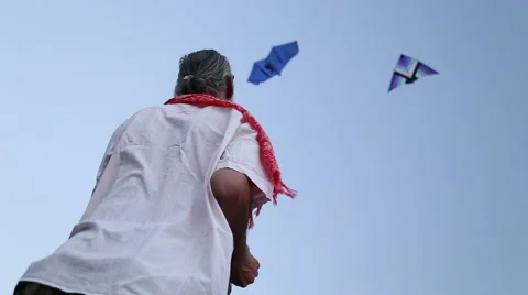 Low angle view of Indian man kiting at beach in Goa. Stock Footage 49667498