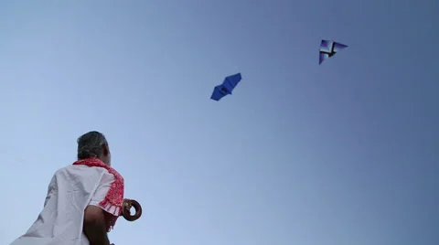 Low angle view of Indian man kiting at beach in Goa. Stock Footage 49667501