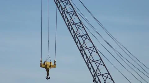 Low Angle View of Industrial Crane Hook Against Clear Blue Sky Stock Photos