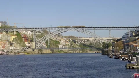 Low angle view of the iron bridge from the river level during the day. Stock Footage 327624675