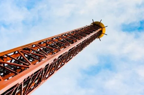 Low angle  view of  iron drop tower or big drop in a amusement  park against Stock Photos