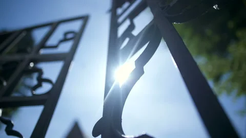 Low angle view of iron gate opening. Stock Footage 89049999