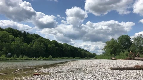 Low angle view of Isar river showing shallow water and pebbles Stock Footage 132659618