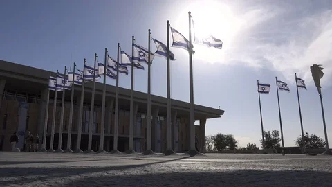Low angle view of Israeli flags in front of the Knesset Stock Footage 71509057