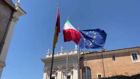 Low-angle view of Italy flag, Roma Capitale, and European Union banners  Stock Footage 337169950