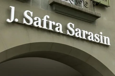 Low angle view of the J. Safra Sarasin private bank sign on a historic faca.. Stock Photos