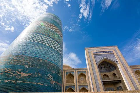 Low angle view of Kalta Minor Minaret and madrasa portal in Khiva, Uzbekist.. Stock Photos