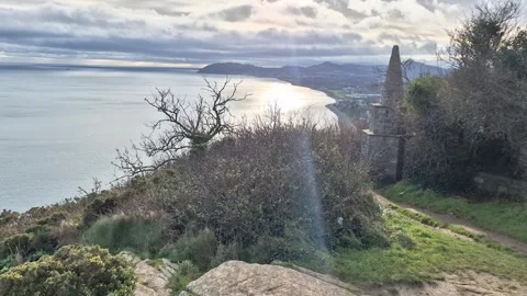 Low Angle View Of Killiney Hill Obelisk Against Blue Sky Stock Footage 327624923