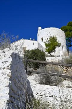 Low angle view of La Magdalena Hermitage access among Mediterranean Pine trees Stock Photos