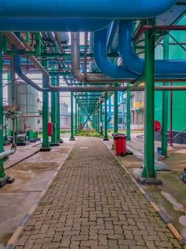 Low-angle view of large pipes arrangement in the factory Stock Photos