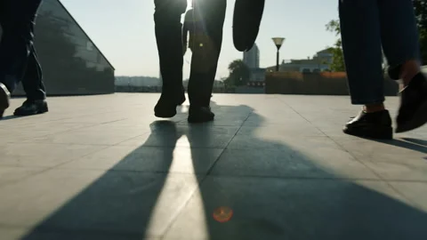 Low angle view of legs in formal trousers and shoes walking outdoors near Stock Footage 157620074