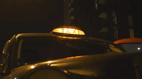 A low angle view of a lit up taxi sign. Stock Footage 101963576