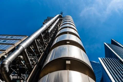 Low angle view of Lloyds Building in the City of London against blue sky Stock Photos