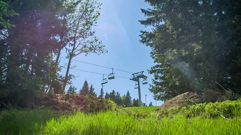 Low Angle View Looking At Empty Chairlifts Going Past In Between Large Stock Footage 124222085
