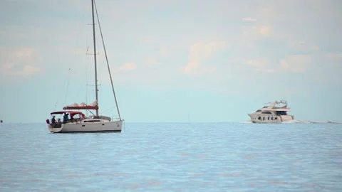 Low angle view of a luxury yacht passing by in open sea Stock Footage 160645999
