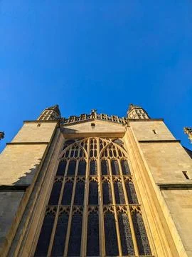 Low angle view of the magnificent Gothic facade of Bath Abbey under a clear blue Stock Photos
