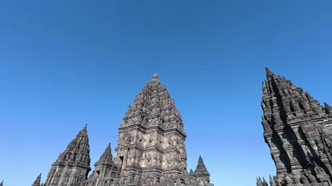 Low-angle view of majestic Prambanan Temple towers and carved stone spires .. Stock Footage 341542736