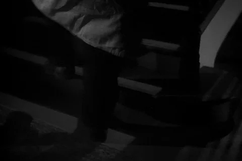 Low angle view of man walking up staircase, 1940s 스톡 동영상 90762252