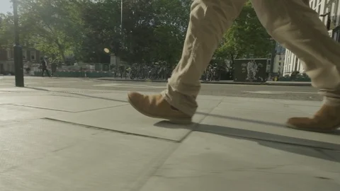 Low angle view of a man walking Video stock 108346560