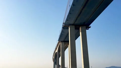 Low-Angle View of the Massive Piers and Underside Structure of Incheon Bridge Stock Footage 329921517