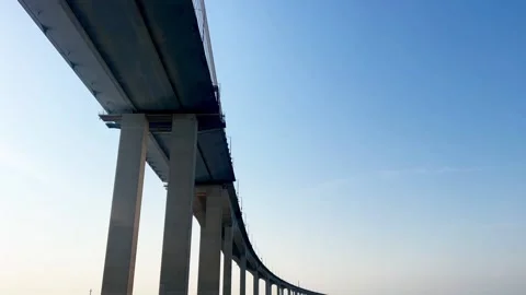 Low-Angle View of the Massive Piers and Underside Structure of Incheon Bridge 库存影片 329921520