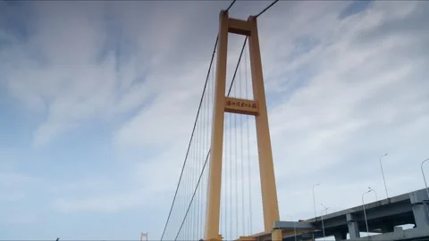 Low angle view of the massive yellow Yangsigang Yangtze River Bridge in Wuhan Stock-Footage 347047539