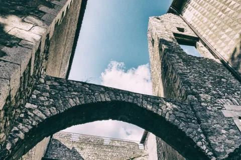 Low angle view of medieval castle arches and walls from an inside courtyard. Stock Photos