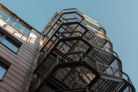 Low-angle view of a metal fire escape staircase Stock Photos