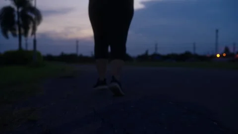 Low-angle view of a middle-aged woman running outdoors Stock Footage 335759687