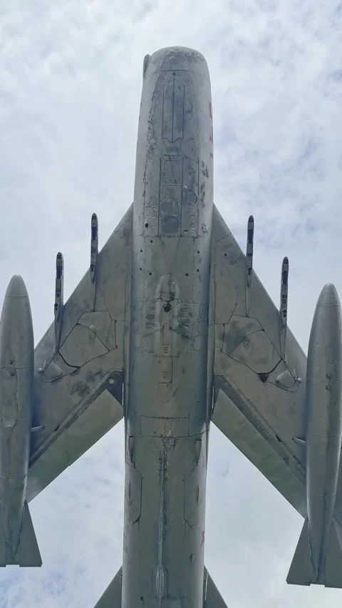 Low angle view MiG-19 fighter jet fuselage with weapons Cold War aircraft Stockbeeldmateriaal 333519502