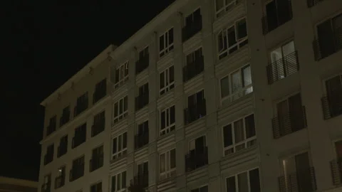 Low-Angle View of Modern Apartment Building at Night 스톡 동영상 343948517