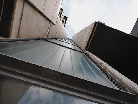 Low angle view of modern architecture in the city. Urban scenes. Stock Photos