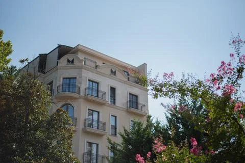 Low-angle view of a modern beige residential building Stock Photos