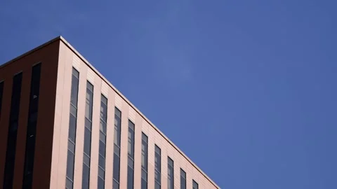 Low Angle View of Modern Building Corner and Blue Sky Stock-Footage 338149681