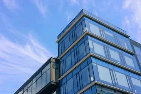 Low angle view of modern buildings against blue sky Fotos de archivo