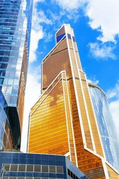 Low angle view of modern business skyscrapers in financial district . Refle.. Stock Photos